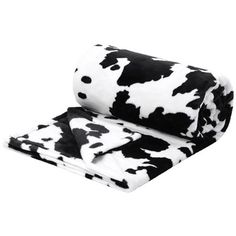 a black and white cow print blanket