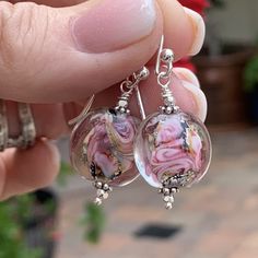 "The two toned rosey pink swirls surround silver and gold foil to give these disk earrings a fabulous sparkle! They measure 1.5 inches from the top of the ear wire to the bottom of the earring. Accent beads are sterling silver as well as the ear wires. The pink bead alone is 16 x 8mm. Your jewelry will arrive in a cotton lined kraft box within a padded postal envelope. I use USPS first class mail. This usually takes 3 to 5 days to ship. International orders outside of the U.S. will take 8 to 15 days to ship. To see more from East Village Jewelry~ http://eastvillagejewelry.etsy.com All orders ship out within 24 hours, excluding holidays and Sundays Feel free to contact me with any questions. Use coupon code VILLAGE14 for 10% off all orders over $200.00 If this is a gift, I offer free handma Unique Nickel-free Pink Earrings, Unique Nickel Free Pink Earrings, Unique Pink Sterling Silver Earrings, Disk Earrings, Handmade Gift Tags, Pink Swirls, Disc Earrings, Homemade Jewelry, East Village