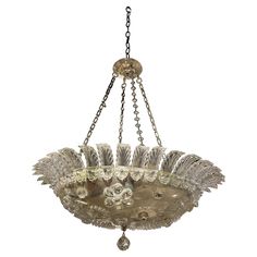 an antique chandelier hanging from a chain