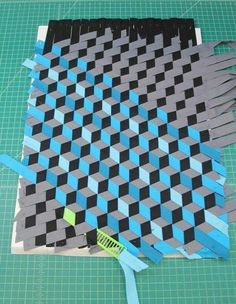 a piece of paper that has been cut out to look like a checkered pattern