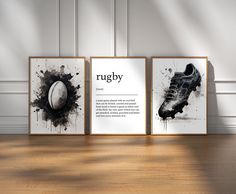 three framed rugby posters on a wooden floor in front of a wall with white walls