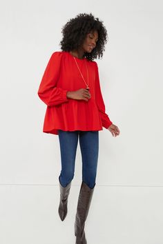 Flowy and flattering, the Carlota Peplum Blouse is a wardrobe must-have. This top features puff sleeves with elastic wrists, keyhole button back closure, high-low silhouette, and a peplum hem detail. Pair with denim and a change of accessories for a look that will take you from desk to drinks! Crew neckline Cuffed sleeves Slightly puffed sleeves High-low Peplum detail Material: 100% Polyester Care: Hand wash cold Chic Fall Peplum Top With Puff Sleeves, Peplum Blouse With Ruffle Hem For Work, Fall Peplum Top For Work, Fall Peplum Top For Workwear, Fall Season Peplum Top For Workwear, Red Lantern Sleeve Blouse For Fall, Fall Workwear Peplum Top, Fall Puff Sleeve Peplum Top With Ruffles, Fall Peplum Top With Ruffles And Puff Sleeves