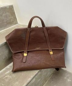 Boutique Versatile Brown Calf Leather Messenger BagThis bag is made of fine Calf Leather fabric.Measurement: 28cm/10.92" * 40cm/15.6" * 15.5cm/6.045"Inside pockets. Versatile Brown Rectangular Duffle Bag, Modern Brown Shoulder Duffle Bag, Brown Laptop Bag With Detachable Handle For Travel, Travel Laptop Bag With Detachable Handle In Brown, Brown Laptop Bag For Travel, Chic Brown Duffle Bag For Daily Use, Brown Rectangular Duffle Bag For Shopping, Elegant Brown Duffle Bag With Top Carry Handle, Elegant Brown Duffle Bag With Double Handle