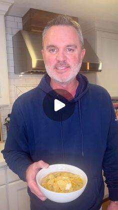 a man holding a bowl of food in his hands