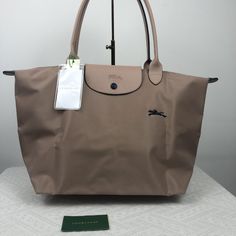 "Simple And Stunning Longchamp Le Pliage Club Tote Large Size In Gorgeous Hawthorn, Stunning Color Between Beige And Pale Pink, One Of My Fav Colors From This Collection One Of The Most Popular Colors In Le Pliage Bags Always Get Sold Out Quickly Double Handles Zip And Snap Closure; Unlined Interior Slip Pocket Foldable Design 12""W X 7.5""D X 11""H; 9"" Hand Drop Nylon, Trim: Cowhide Leather" Longchamp Le Pliage Club, Longchamp Tote Bag, Polka Dot Tote Bag, Yellow Tote Bag, Brown Leather Tote Bag, Longchamp Bag, Suede Tote Bag, Brown Tote Bag, Blue Tote Bag