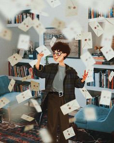 a man standing in front of a book shelf filled with books and envelopes flying through the air