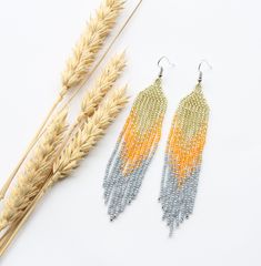 These colorful beaded earrings are made using traditional freehand beading techniques. Earrings are made of quality Czech beads and strong thread. You can choose the option of a Hypoallergenic Earring Hooks, 925 sterling silver hooks or 925 silver leverbacks. Earrings are 11.5 cm ( 4.5 inches)  length with hooks and 2 cm ( 0.8 inches) width. Colors: glass,orange,gray. 100% handmade. See more of long size earrings here: https://www.etsy.com/shop/SandasHandmades?ref=seller-platform-mcnav&section_i Bohemian Beaded Chain Earrings For Summer, Bohemian Style Beaded Chain Earrings For Summer, Handwoven Beaded Earrings With Round Beads For Summer, Handwoven Beaded Earrings For Jewelry Making In Summer, Handwoven Earrings For Jewelry Making In Summer, Handwoven Beaded Earrings For Summer, Cute Gifts For Her, Beading Techniques, Handmade Earrings Beaded