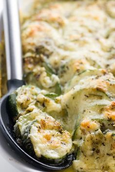 a casserole dish with broccoli and cheese in it, ready to be eaten