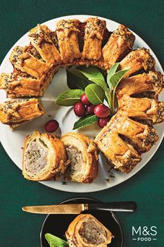 the cover of m & s food magazine features meat rolls and cranberry sauce