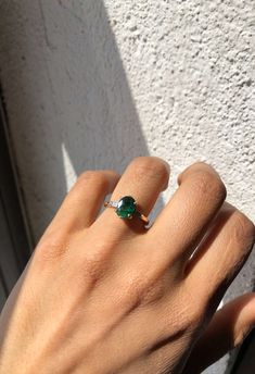 Custom sized in 1 week, provided we have it in stock. Please contact us about rush orders. A unique 1.75ct oval shaped emerald, with black textures, set in a 14k yellow gold setting with 2 tapered baguette diamonds Specifications: 1.75ct Oval emerald, 0.2ct diamonds in 14k gold. Please note emerald texture may vary from photo, each emerald has its own unique color variation Please contact us for other metal colors and sizes not listed Oval Emerald Ring, Women's Wedding Bands, Traditional Engagement Rings, Gold Ring Designs, Engagement Rings Oval, Bling Rings