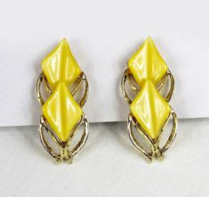 "Up for sale are a pair of vintage earrings with cute yellow plastic. They are gold tone and unmarked. The earrings measure 1.5\" in size and are in good vintage condition. Please feel free to contact me with any questions! Please Contact for International Shipping!" Vintage 1960s, Vintage Earrings, Clip On, Clip On Earrings, Etsy Earrings, 1960s, Gold Tones, Jewelry Earrings, Etsy Uk