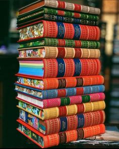 a stack of books sitting on top of a table