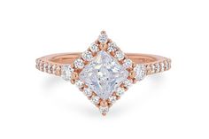 a rose gold engagement ring with a princess cut diamond surrounded by pave set diamonds