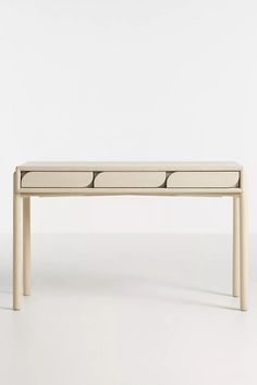 a white table with four drawers on it