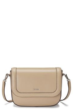 Clean lines and subtle branding lend minimalist appeal to this structured crossbody bag that's shaped from buttery-soft leather. Magnetic-snap flap closure Exterior slip pocket Interior zip and slip pockets Lined Leather Imported Modern Beige Flap Shoulder Bag, Modern Beige Crossbody Flap Bag, Modern Soft Leather Flap Shoulder Bag, Classic Beige Crossbody Flap Bag, Beige Flap Bag With Magnetic Closure, Beige Crossbody Flap Bag For Business, Beige Flap Bag With Adjustable Strap For Business, Beige Business Flap Bag With Adjustable Strap, Beige Flap Bag With Magnetic Closure For Travel