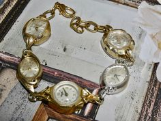 **WATCHES DO NOT WORK** This watch is mixed gold and silver metal plated. ** This bracelet does not have any pins on the side of the watches. Two if the watches may have diamond chips. A one of a kind bracelet made with beautiful vintage women's watches. These watches don't work, just for the pure beauty of these old timepieces. I use split ring jump rings so the possibility of it pulling apart is very low. I love this bracelet and its has very high quality details. The watches on each bracelet Gold Quartz Bracelet Watch, Vintage Watches Women, Watch Bracelet, Chain Extenders, Women's Watches, Two Tone Watch, Pure Beauty, Bracelet Collection, Split Ring