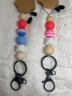 two pairs of scissors are attached to some beads