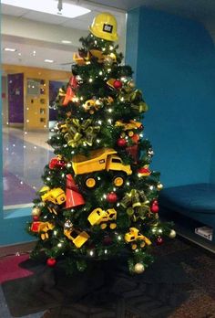 a christmas tree decorated with construction themed decorations