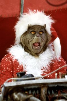 a man dressed as santa clause with an electric keyboard