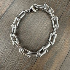 So on-trend and perfect for every day. Beaded hardware link stainless steel bracelet is great to layer or wear alone. Large Link: Approximately .3" Link Width 8" Chain Length 1lbs Weight Medium Link: Approximately .25" Link Width 8" Chain Length .6 lbs Weight Small Link: Approximately .2" Link Width 88" Chain Length .6 lbs Weight Bead Bar, Hammered Metal, Silver Bangle Bracelets, Statement Bracelet, Steel Bracelet, Ring Bracelet, Stainless Steel Bracelet, Stretch Bracelets, Silver Bracelets