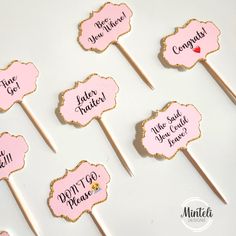 pink and gold cake toppers with words on them