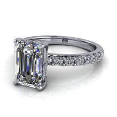 an emerald cut diamond engagement ring with side stones