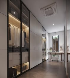 an empty walk in closet with glass doors