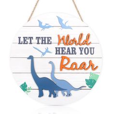 a wooden sign that says let the world hear you roar with dinosaurs and birds on it