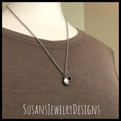 "This necklace is made with a tiny teardrop shaped stainless steel urn, a Swarovski crystal of your choice, and strung on a stainless steel chain. Flower urn has a drop of just under 3/4\" including jump rings at the top. Use the Options Pull Down menu to select your crystal and chain preferences. PLEASE NOTE: May - dk green and Dec. - turquoise has a style substitution due to Swarovski ceasing production of most of their crystals, including channel styles previously used in this listing. I no l Sterling Silver Teardrop Birthstone Charm Necklace, Silver Teardrop Pendant Birthstone Necklace, Silver Teardrop Birthstone Charm Necklace, Personalized Teardrop Pendant Keepsake Jewelry, Silver Teardrop Birthstone Necklace, Personalized Teardrop Keepsake Jewelry, Sterling Silver Teardrop Charm Necklace For Anniversary, Flower Urn, Baby Mom