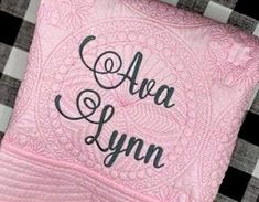 a pink and black checkered table cloth with the words area lynn on it