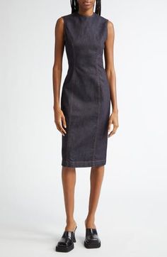 The Stockholm-based label offers a polished alternative for denim days with this sleeveless sheath dress detailed with contrast topstitching. Back zip closure Jewel neck Sleeveless 97% cotton, 3% elastane Dry clean Made in Italy Designer Clothing Sleeveless Dark Wash Workwear Dress, Dark Wash Sleeveless Dress For Work, Sleeveless Dark Wash Dress For Work, Elegant Sleeveless Denim Dress, Elegant Sleeveless Denim Blue Dress, Elegant Fitted Denim Blue Dress, Fitted Summer Dress With Seam Detailing, Elegant Dark Wash Dress For Work, Elegant Knee-length Dark Wash Denim Dress