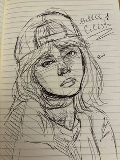 a drawing of a woman's face on lined paper