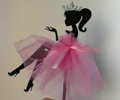 a silhouette of a woman wearing a pink dress and a tiara with the word barbie on it