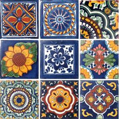 many colorful tiles with different designs and colors on them, including sunflowers in the center