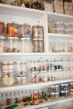 shelves filled with lots of different types of items and containers on top of each other