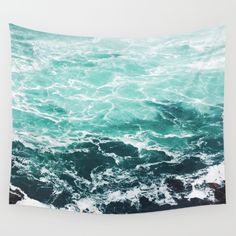 an aerial view of the ocean with waves crashing on it's surface wall tapestry