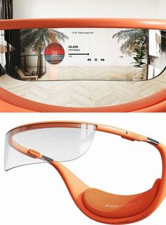 an orange frame with clear lens on the top and bottom of it, in front of a mirror