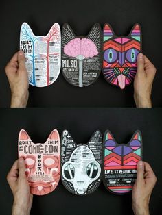 three different pictures of cats made out of paper with words and images on the faces