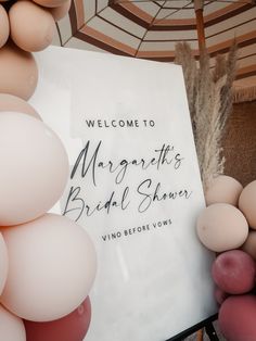 a sign and balloons are on display at a bridal shower