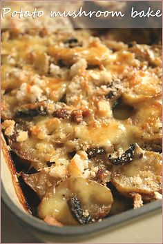 a casserole dish with potatoes and mushrooms in it is ready to be eaten