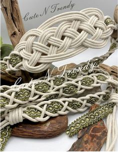 an assortment of white rope and wood beads on top of some driftwood pieces with the words, cute n friendly