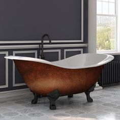 an old fashioned claw foot bathtub in a bathroom with gray walls and flooring