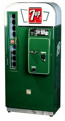 an old fashioned vending machine with 7up on top