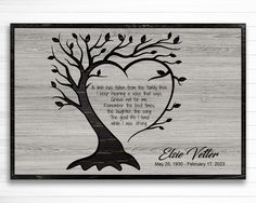 a wooden plaque with a tree and heart on it