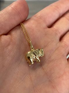 14k yellow gold good luck elephant charm necklace. Material: Genuine 14k solid yellow gold. Height: From Bail to the bottom is about 3/4 of an inch tall. Elephant itself is about 1/2 an inch tall. Width: approximately 1/2 an inch wide from trunk to tail. Weight: approximately 1.6 grams. *Chain sold separately* Chains are approximately 1.5 grams, available at check out. Comes in a nice box. Elephant Pendant Gold, Afro Jewelry, Gold Elephant Pendant, Pretty Gold Necklaces, Elephant Necklace Gold, Stylish Jewelry Accessories, Good Luck Elephant, Yellow Elephant, Elephant Charm Necklace