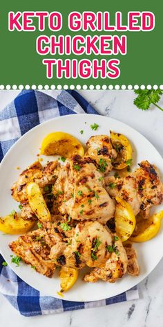 grilled chicken thighs on a plate with lemons and parsley garnish