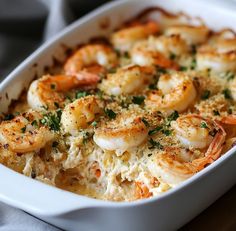 a casserole dish filled with shrimp and cheese