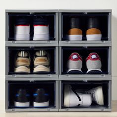 several pairs of shoes are stored in clear bins