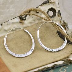 Hand Forged Hoop Earrings We ♥️ them and you will too! #silvergirl #hoopearrings Artisan Small Hoop Sterling Silver Earrings, Hammered Sterling Silver Hoop Jewelry, Hand Forged Sterling Silver Hoop Earrings For Everyday, Silver Hammered Artisan Hoop Earrings, Artisan Hammered Round Hoop Earrings, Artisan Silver Hammered Hoop Earrings, Hammered Sterling Silver Teardrop Hoop Earrings, Hammered Sterling Silver Hoop Earrings In Silver, Silver Hammered Hoop Jewelry