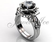 a white gold engagement ring set with a flower and leaves design